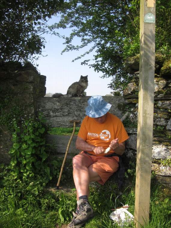 Prof Blackmore's closest stile as it used to be, with her husband's cat watching his whittling