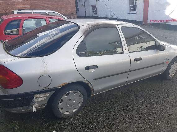 The car in the Kings Arms car park, with blacked out windows from the fire (Sam Acourt)