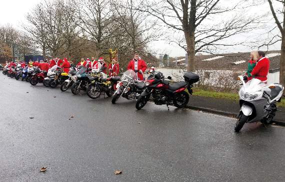 Some of the 140 'Santas on a bike' getting ready for the off at Lee Mill