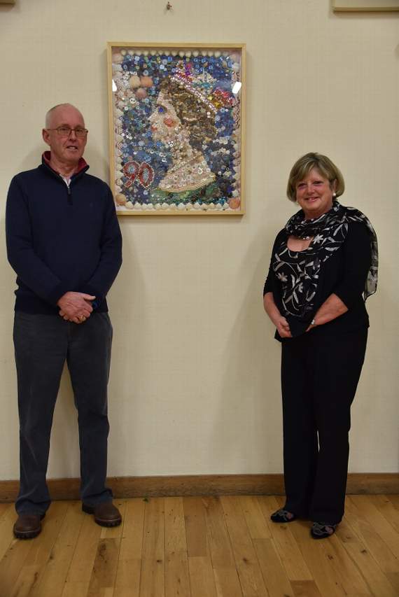 Pip Hallett, chairman of Village Hall Committee and Judy Lovick, president of the WI, with the portrait
