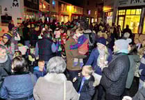 Families and friends gather to enjoy the traditional switching on of Salcombe's Christmas lights