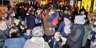 Families and friends gather to enjoy the traditional switching on of Salcombe's Christmas lights