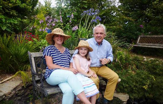 Erica Blumer, Andy Hall and Sophie enjoy the garden