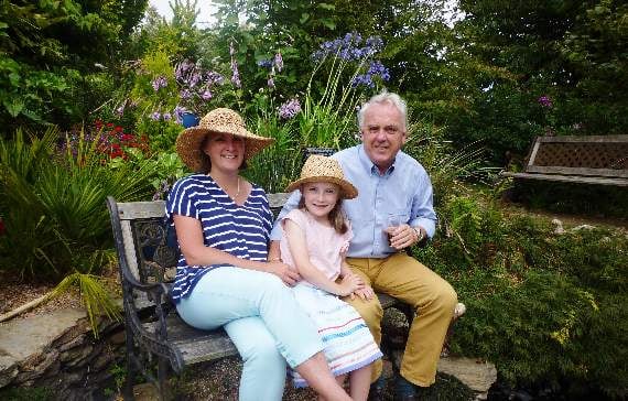 Erica Blumer, Andy Hall and Sophie enjoy the garden