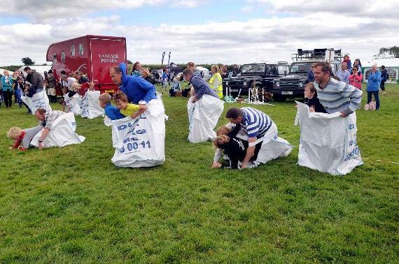 Dumpy bag race (one adult and two kids in each bag)