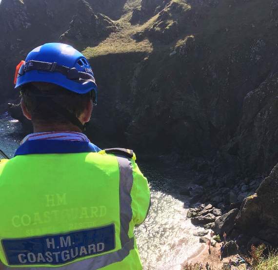 A member of Prawle Point Coastguard Rescue Team surveying the situation above Elender Cove (Prawle Point Coastguard Rescue Team)
