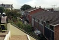 VIDEO: Car crashes into eaves of a house in Dartmouth
