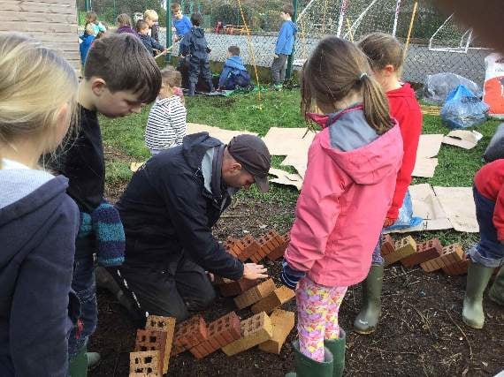 Pupils building an African keyhole garden at Aveton Gifford Primary School