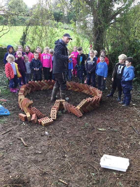 Pupils building an African keyhole garden at Aveton Gifford Primary School