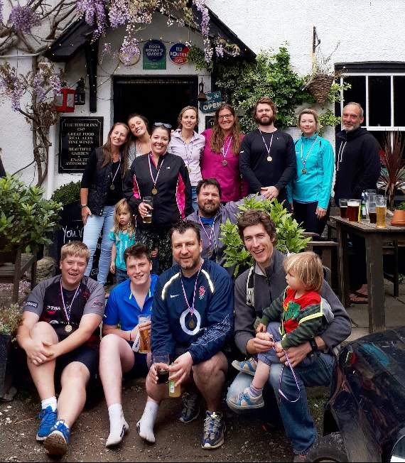 Parents and friends of Merry-Go-Round Preschool celebrate completing their charity run with a roast at The Tower Inn, Slapton.