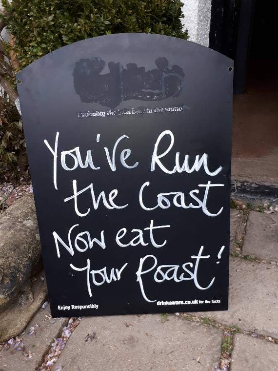 A welcoming sign for the runners at the Tower Inn, Slapton.