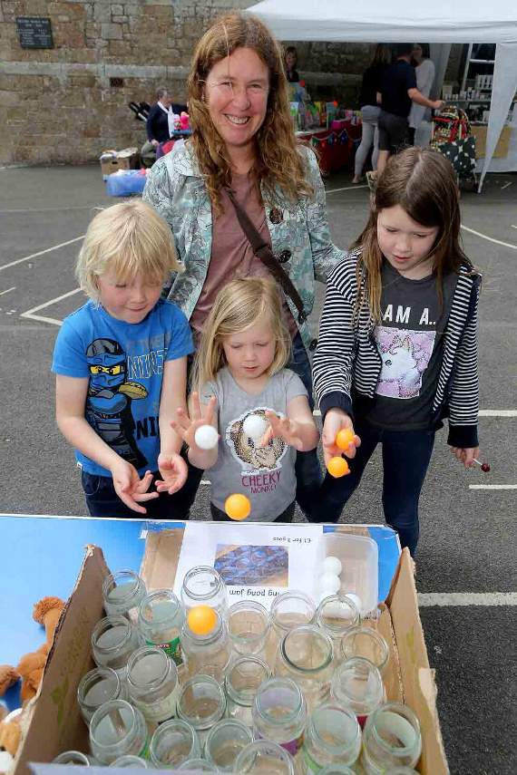 Fun at the ping-pong ball game for Bethany - 7, Jacob - 6, Chloe - 4 and mum Tina Thomas