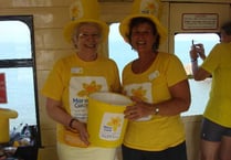 A thousand pounds was raised for Marie Curie by a tea party on the steam train from Paignton to Kingswear