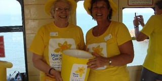 A thousand pounds was raised for Marie Curie by a tea party on the steam train from Paignton to Kingswear