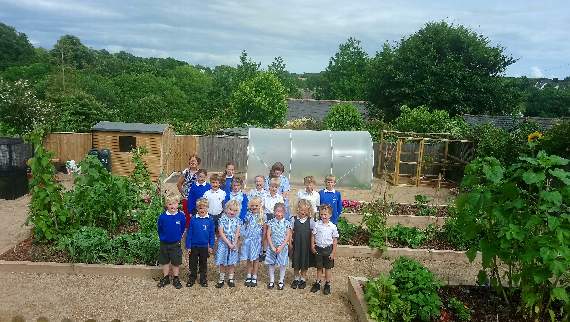 Modbury Primary School pupils in their kitchen garden, with Katherine Pemberton, year 5 lass teacher