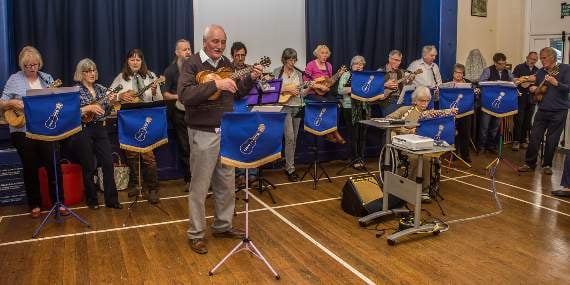The Reverend Neil Barker playing his new present of a ukulele (Mike Wynne-Powell)