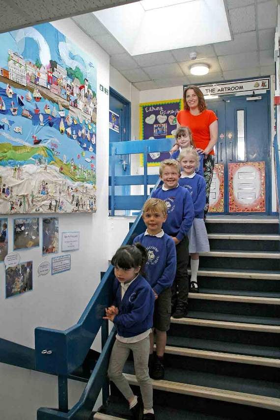 From the bottom of the stairs, Pearl Getley (Foundation), Henry Downes (Year 1), Rocco Towns (Year 2), Nina Walker (Year 2) Honey Getley (Year 3) and Hannah Getley