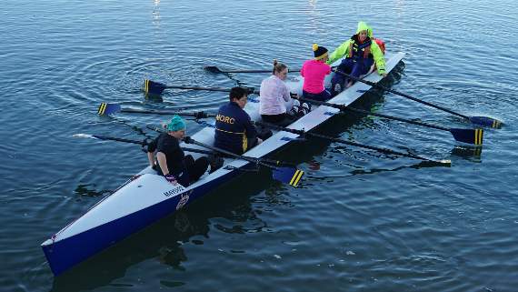 Sophie Harris, centre, wearing light-coloured top, with the Mayflower Offshore Rowing Club in Plymouth