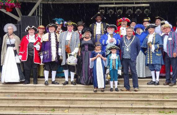 The town criers and their escorts on the Bandstand, Kingsbridge