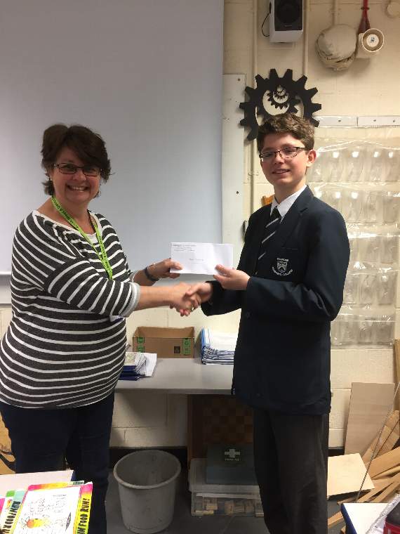 Max Pettett receives his prize from SBADC coordinator Jane Sullivan