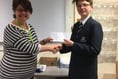 Max wins contest to design caring charity's new logo