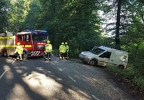 Van and driver escape unscathed after cliffhanger crash over Avon