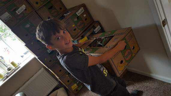Oliver Jones with some of the boxes of donated shoes