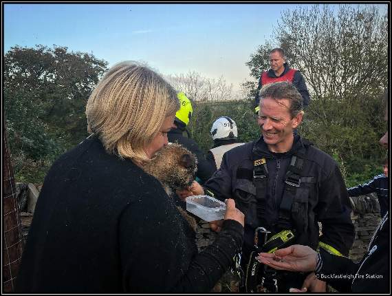 Buckfastleigh Fire Station: Ted with his rescuer just after being returned to the surface