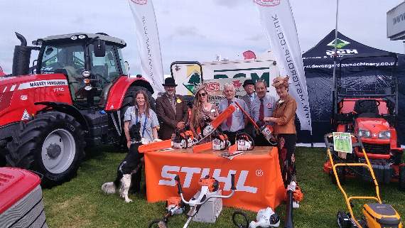 Show chair Apple Taylor and Show president Jo Lapthorn try out the products on the MST stall