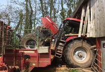 Farmer thrown out of a tractor before it smashed into a cattle shed is lucky to be alive