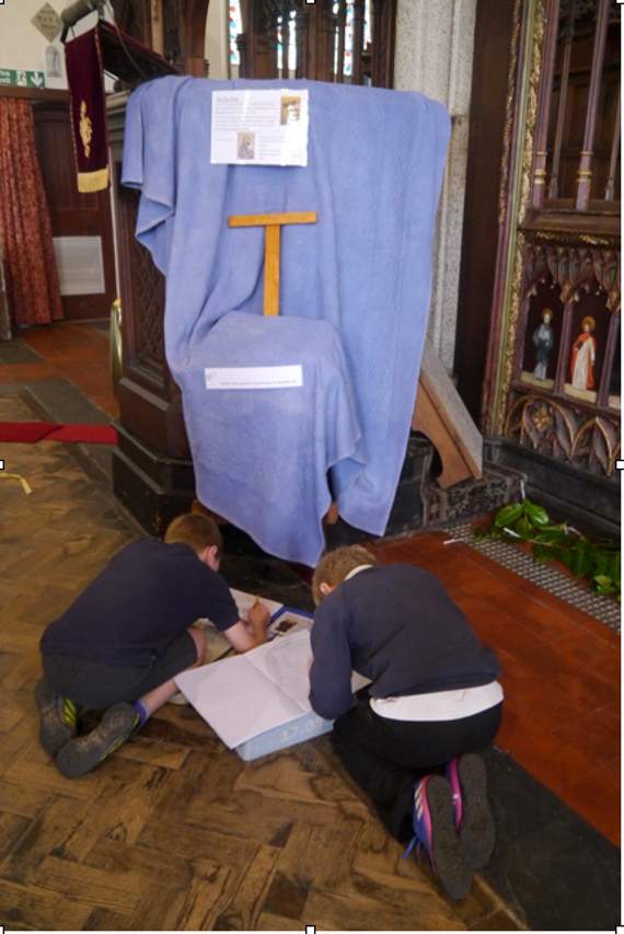 School children draw their interpretations of the cross