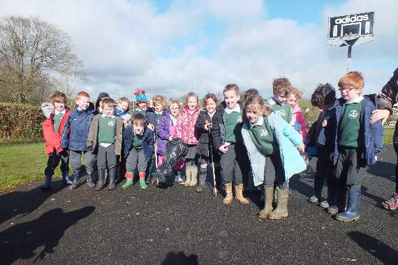rubbish pickers and planters at the recreation ground
