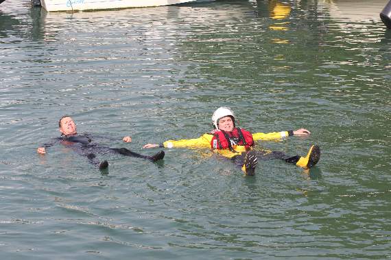 John Fenton:RNLI Dart volunteer crew members demonstrate the float technique