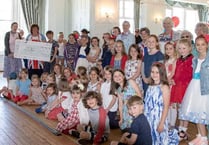 Beehives, Brownies and Rainbows sip tea in celebration