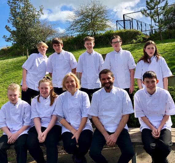 Serin Aubrey from Dartmouth Food Festival and Jenny Chanter from Dartmouth Academy with academy pupils