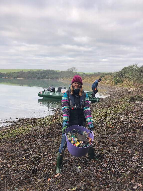 Emily Price with a bucket full of marine rubbish (Credit: Kristen Bounds)