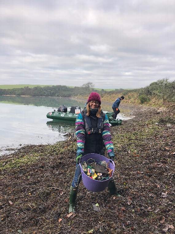 Emily Price with a bucket full of marine rubbish (Credit: Kristen Bounds)