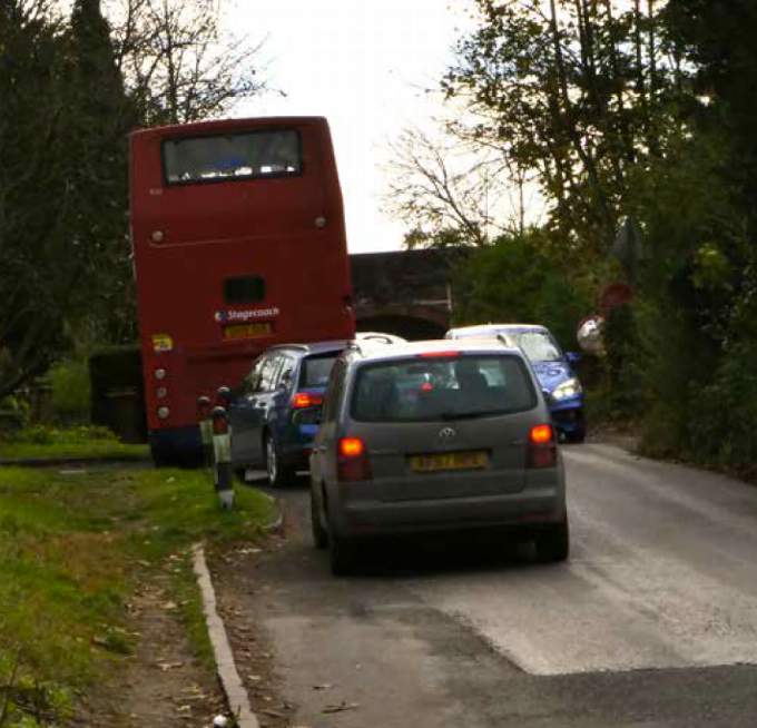 A bus approaches the Northfield Lane railway bridge, 11am, Monday, November 8, 2021