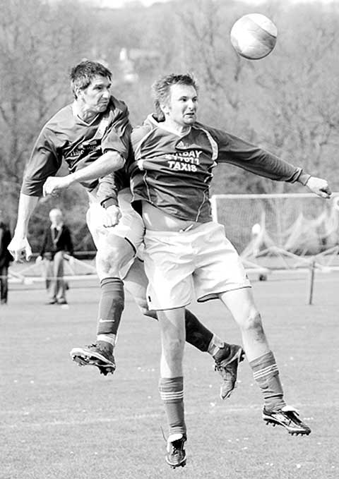  Robbie Williams rises to the challenge to outjump the Hele Rovers player. Picture by abphotographic.com