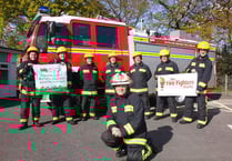 Firefighters complete arduous charity walk from Okehampton to Lynton