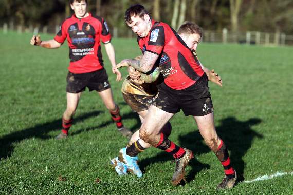 Louis Cockcroft takes a hit for Tavistock. Pictures by Chris Hair