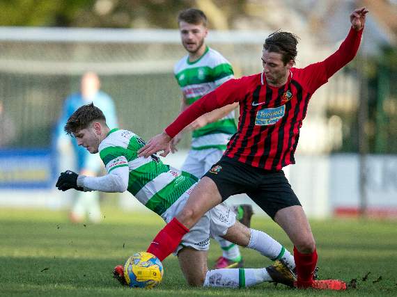 Tavistock (in red and black) in a tough encounter at Westbury. Pictures by Dave Crawford.