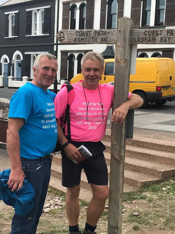 John Moyse, right, and a friend in Sidmouth during the walk.