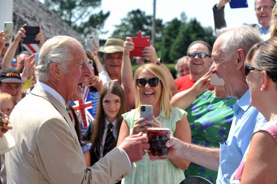 Prince Charles is handed a refreshing pint of beer by Duke of York landlord John Pittam. Pictures by Steve Pope