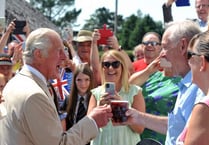 Prince Charles enjoys a pint at the Iddesleigh local and meets War Horse author