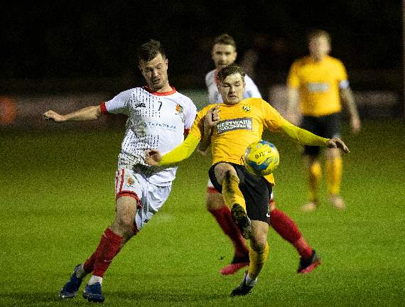 Tallan Burns of Tavistock battles for the ball