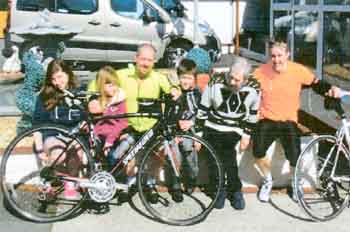 Adam Crawley is pictured with his father Ray, uncle and family, and cycle partner Donan at Brooklands Nursing Home.