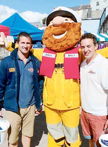 Lifeboatmen Rhys Thomas (left) and Ben Field-Thomas are pictured with RNLI mascot Stormy Stan who made a welcome appearance.