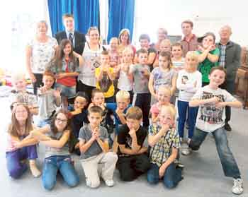 Monkton Holiday Club children with, (from left to right in the back row) Mrs. Griffiths, William James from Valero, Kelly Williams, Alison Davies, Mrs George, Mr Rossi and Brian Lavender from the Co-operative Group.
