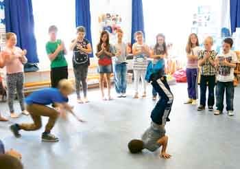 The children learn how to break dance with Kelly Williams.